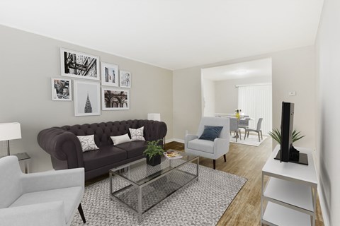 a living room with a leather couch and a glass coffee table